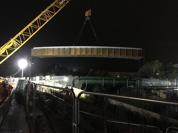 Major bridge lifted into place over railway in Apsley
